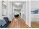 Spacious hallway with hardwood floors, bright white trim, and a view to another room at 805 Ponce De Leon Ne Ter, Atlanta, GA 30306