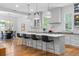 Modern kitchen with an island and bar stool seating, and views to an adjacent dining space at 805 Ponce De Leon Ne Ter, Atlanta, GA 30306