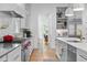 Open kitchen with stainless steel appliances, gray countertops and adjacent dining area at 805 Ponce De Leon Ne Ter, Atlanta, GA 30306