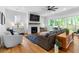Living room with fireplace, large sliding doors to patio, and comfortable seating at 805 Ponce De Leon Ne Ter, Atlanta, GA 30306