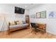 Bright living room with daybed, desk, modern finishes and a large tv screen for entertainment at 805 Ponce De Leon Ne Ter, Atlanta, GA 30306