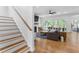Staircase leading to an open living space with fireplace and sliding doors to the patio at 805 Ponce De Leon Ne Ter, Atlanta, GA 30306