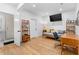 Cozy living room with daybed, desk, and modern finishes; features sleek wood floors and a glass-enclosed shower at 805 Ponce De Leon Ne Ter, Atlanta, GA 30306