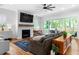 Bright living room with fireplace, large sliding doors to patio, and modern decor at 805 Ponce De Leon Ne Ter, Atlanta, GA 30306