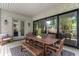 Covered patio featuring wood dining table, a lounge chair and sliding doors for indoor/outdoor living at 805 Ponce De Leon Ne Ter, Atlanta, GA 30306