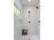 Modern shower with white tiled walls, rainfall showerheads, and a built-in seat at 805 Ponce De Leon Ne Ter, Atlanta, GA 30306