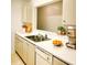 Kitchen with white countertops, stainless steel appliances, and decorative fruit and greenery at 19302 Waldrop Cv, Decatur, GA 30034