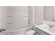 Bright bathroom features a bathtub and a modern vanity sink at 1950 Van Allen Ct, Dacula, GA 30019