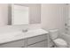 Well-lit bathroom featuring a modern vanity, large mirror, and a shower-tub combination at 1950 Van Allen Ct, Dacula, GA 30019