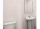 Bathroom featuring pedestal sink and toilet at 1950 Van Allen Ct, Dacula, GA 30019