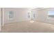 Bright, open bedroom with plush carpeting and ample natural light from multiple windows at 1950 Van Allen Ct, Dacula, GA 30019