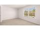Bedroom with a large window offering natural light and a view at 1950 Van Allen Ct, Dacula, GA 30019