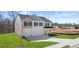 Well-maintained two-story home featuring a two-car garage, lush green lawn, and classic design elements at 1950 Van Allen Ct, Dacula, GA 30019