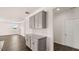 Butler's pantry featuring gray cabinets, granite countertops, and modern backsplash at 1950 Van Allen Ct, Dacula, GA 30019