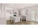 Kitchen featuring stainless steel appliances, an island, and access to the backyard at 1950 Van Allen Ct, Dacula, GA 30019