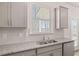 Kitchen with a stainless steel sink and modern gray cabinets at 1950 Van Allen Ct, Dacula, GA 30019