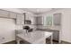 Modern kitchen featuring gray cabinets, stainless steel appliances, and a granite countertop island at 1950 Van Allen Ct, Dacula, GA 30019