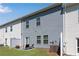 Townhouse backyard with seating area, small patio, and privacy fences at 218 Jordan Dr, Woodstock, GA 30188