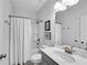 Bathroom featuring a vanity with white countertop, toilet, and tub-shower at 218 Jordan Dr, Woodstock, GA 30188