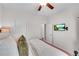 Bright bedroom featuring a bed, ceiling fan, and mounted TV at 218 Jordan Dr, Woodstock, GA 30188