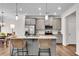 Bright kitchen featuring gray cabinets, granite countertops and stainless steel appliances at 218 Jordan Dr, Woodstock, GA 30188
