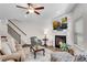 Comfortable living room with fireplace, a ceiling fan and staircase leading to a different floor at 218 Jordan Dr, Woodstock, GA 30188