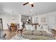 Open-concept living room with dining area and kitchen, providing an integrated living space at 218 Jordan Dr, Woodstock, GA 30188