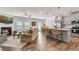 Open-concept living room with a fireplace, modern furniture, and seamless flow to the kitchen at 218 Jordan Dr, Woodstock, GA 30188