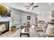 Bright living room featuring a fireplace, comfortable seating, and an open layout perfect for entertaining at 218 Jordan Dr, Woodstock, GA 30188