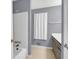 View of the bathroom with a single sink vanity and white tiled shower-tub at 260 Lamplighter Se Ln, Marietta, GA 30067