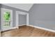 A bedroom with wood floors, a closet and a door leading to the outside at 260 Lamplighter Se Ln, Marietta, GA 30067