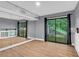 This bedroom features wood flooring, large windows and access to the outside at 260 Lamplighter Se Ln, Marietta, GA 30067