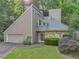 Inviting contemporary home with stone accents, lush landscaping, and a two-car garage nestled in a wooded setting at 260 Lamplighter Se Ln, Marietta, GA 30067