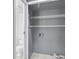 This is a laundry area with shelving, washer/dryer hookups, and adjacent toilet at 260 Lamplighter Se Ln, Marietta, GA 30067
