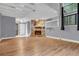 Spacious living room featuring a stone fireplace, hardwood floors, and a view of the mezzanine above at 260 Lamplighter Se Ln, Marietta, GA 30067