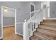 Staircase landing with hardwood flooring and white railing at 260 Lamplighter Se Ln, Marietta, GA 30067