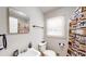 Cozy bathroom with a quirky shower curtain, a sink with a vintage-style faucet, and a bright window at 2628 Hickory Trl, Snellville, GA 30078