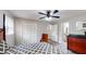 Bright bedroom with a gray accent walls, ceiling fan, and closet at 2628 Hickory Trl, Snellville, GA 30078