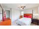 Well-lit bedroom with wood-look floors, a closet, and a quaint orange chair at 2628 Hickory Trl, Snellville, GA 30078