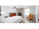 Relaxing bedroom with a brick fireplace and comfortable bed, with gray colored walls at 2628 Hickory Trl, Snellville, GA 30078