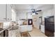Bright kitchen featuring white cabinetry, granite countertops, and modern appliances at 2628 Hickory Trl, Snellville, GA 30078