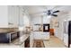 Bright kitchen featuring white cabinetry, granite countertops, and modern appliances at 2628 Hickory Trl, Snellville, GA 30078