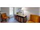 Cozy sitting area with wood-look flooring, accent chairs and adjacent to an entry door at 2628 Hickory Trl, Snellville, GA 30078