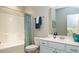 Hall bathroom featuring a tub and shower, toilet and vanity with sink at 655 Blackshear Trl, Temple, GA 30179