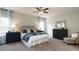 Bedroom featuring a bed with blue patterned bedding, matching nightstands and large windows at 655 Blackshear Trl, Temple, GA 30179