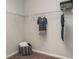 Organized walk-in closet with shelves, hanging rods and carpet floors at 655 Blackshear Trl, Temple, GA 30179
