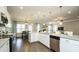 Modern kitchen with an open layout featuring stainless steel appliances and granite countertops, perfect for entertaining at 655 Blackshear Trl, Temple, GA 30179