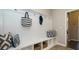 Mudroom with a built-in bench, storage cubbies and coat hooks at 655 Blackshear Trl, Temple, GA 30179