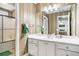Bathroom with a sink vanity, framed mirror and shower-tub combination at 130 Honey Ln, Fayetteville, GA 30214