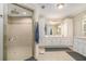 Bright bathroom featuring a tiled walk-in shower, double sinks, and spacious layout at 130 Honey Ln, Fayetteville, GA 30214